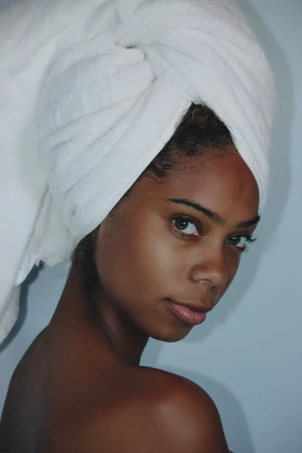 woman wearing white towel on her head